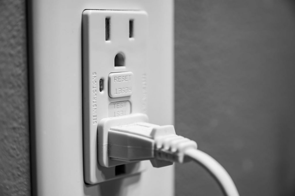 A GFCI outlet controls the electricity output in case of surges